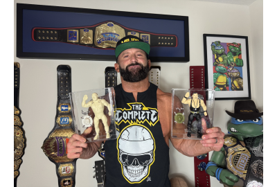 Wrestler Matt Cardona holds some CAS graded figures